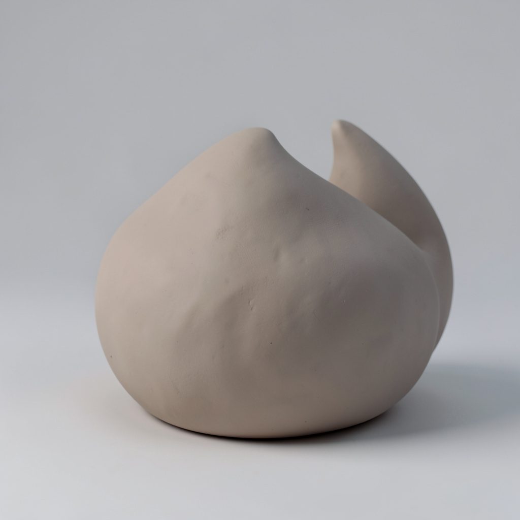 Soft clay-model render in warm sand tones, rounded handmade forms with a natural, calm studio mood